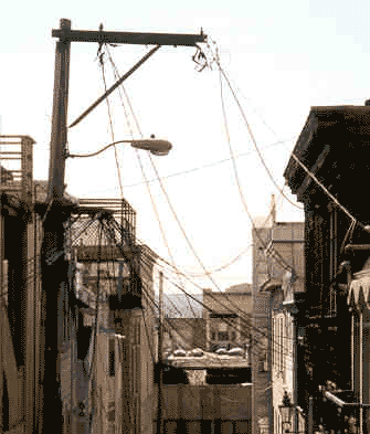 In the less seen spaces between buildings the cobwebs of communication accumulate.